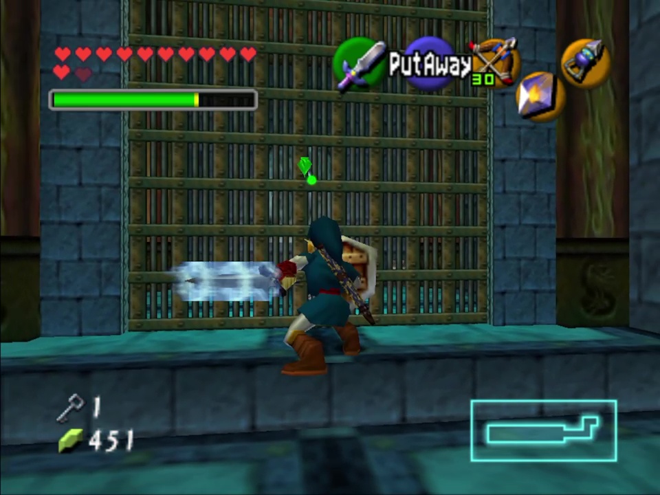 Charge your sword to hit this switch behind a cage, or use a bomb