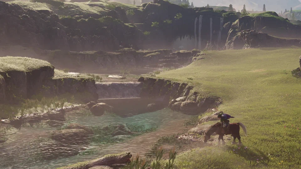 Adult Link on Epona beside a stream in a misty valley, Epona lowering her head to drink, a small weir in the stream and waterfalls pouring off the cliffs behind