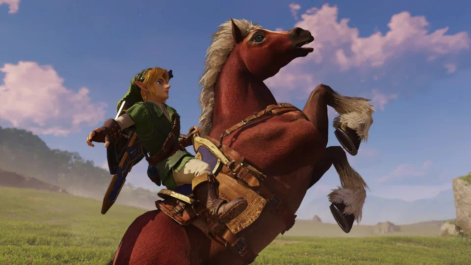 Low-angle close-up of adult Link on a rearing Epona against a blue sky, arm flung out for balance, the Hylian Shield on his back, Epona's white mane and feathered hooves in motion